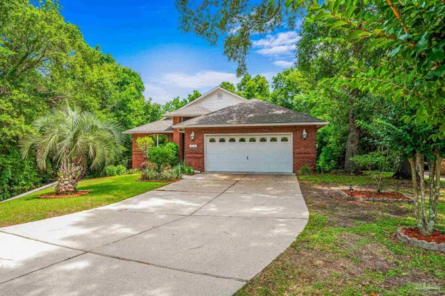 a living room with furniture a flat screen tv and a large window