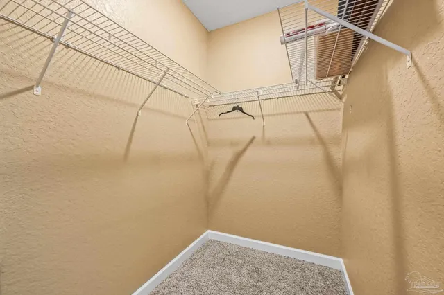 a view of walk in closet with window