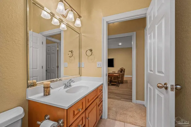 a view of a livingroom with furniture and a flat screen tv