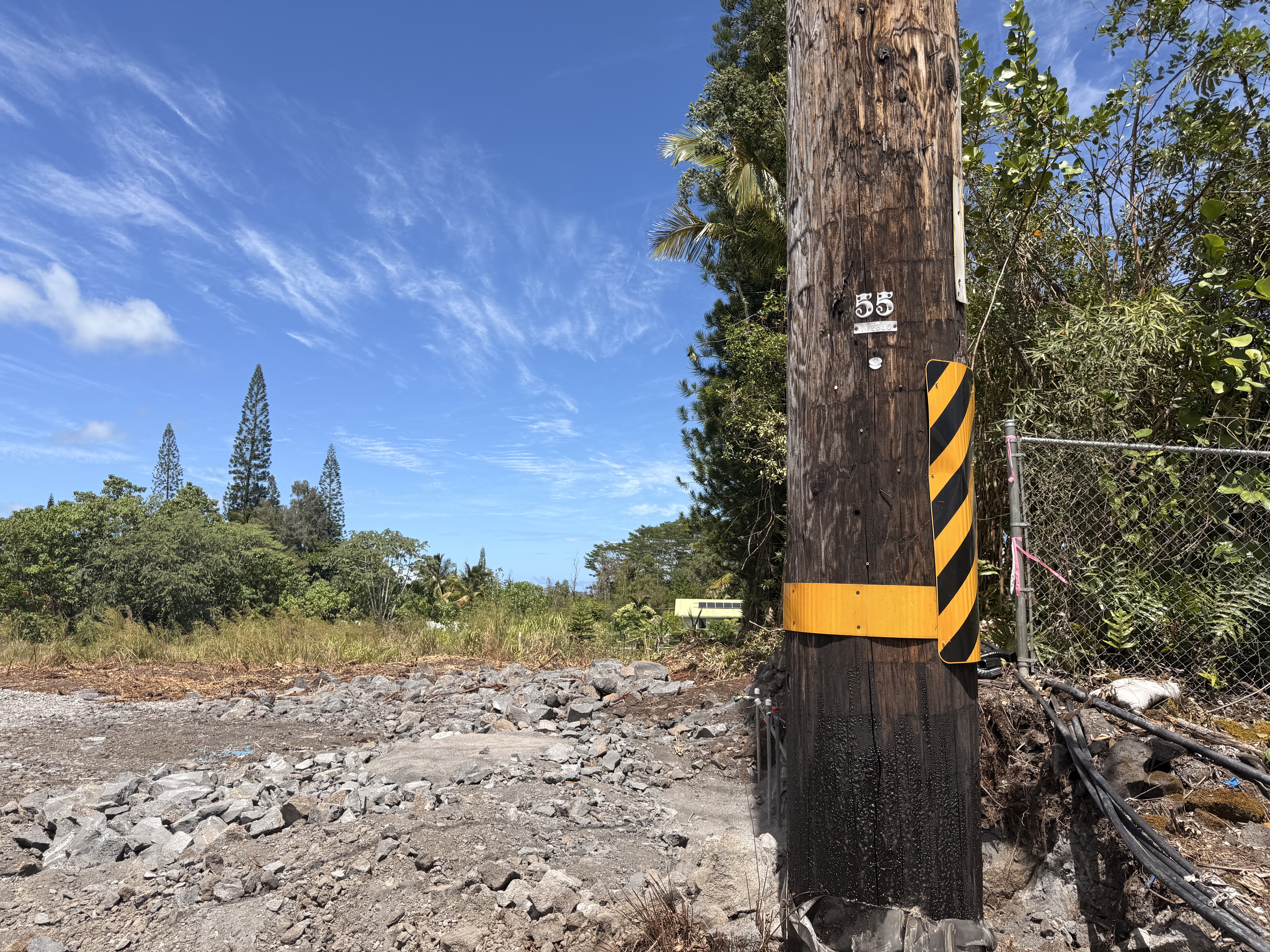 1 Keaau-Pahoa Road Keaau, HI 96749 - Photo 2 of 8 a street sign on a side of the road