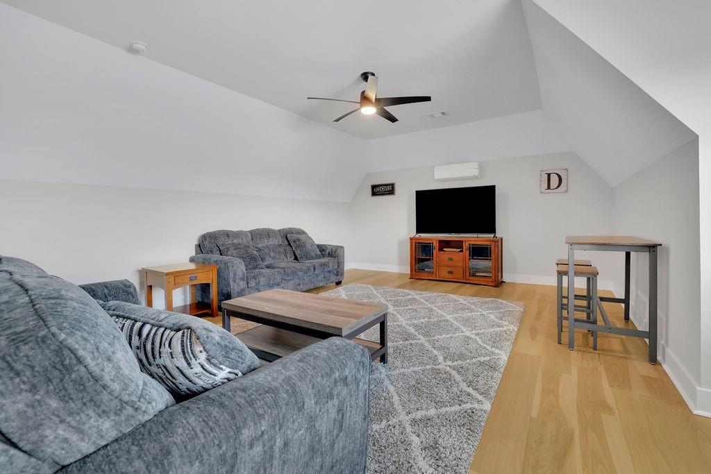 29 Ravenfield Road Taylorsville, GA 30178 - Photo 38 of 80 a living room with furniture and a flat screen tv