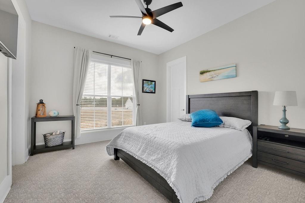 29 Ravenfield Road Taylorsville, GA 30178 - Photo 46 of 80 a bedroom with a bed and a chandelier