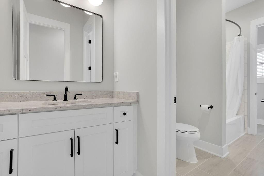 29 Ravenfield Road Taylorsville, GA 30178 - Photo 48 of 80 a bathroom with a toilet sink and mirror