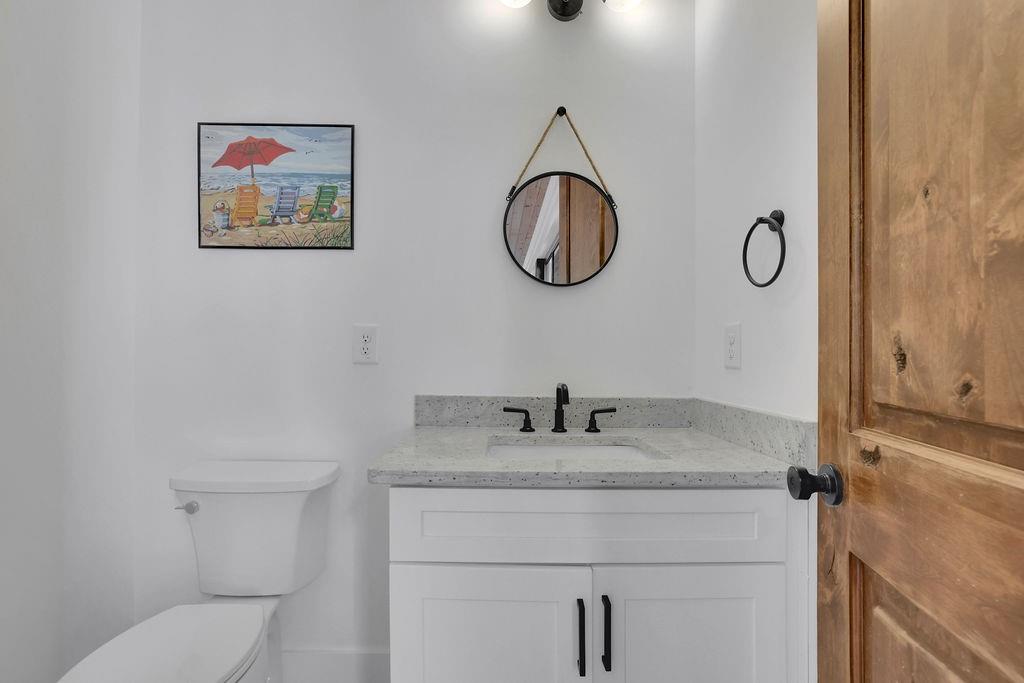 29 Ravenfield Road Taylorsville, GA 30178 - Photo 49 of 80 a bathroom with a granite countertop toilet sink and mirror
