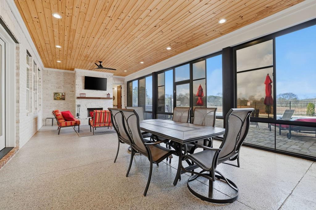 29 Ravenfield Road Taylorsville, GA 30178 - Photo 50 of 80 a dining room with furniture and a floor to ceiling window