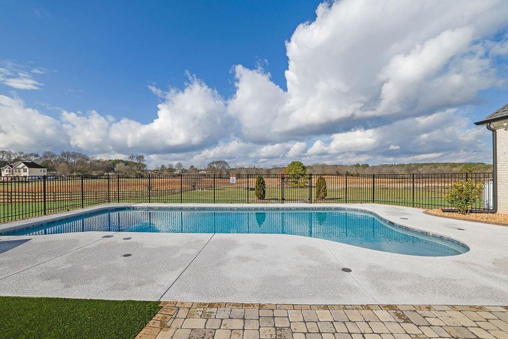 29 Ravenfield Road Taylorsville, GA 30178 - Photo 54 of 80 a view of swimming pool with a yard and sitting area