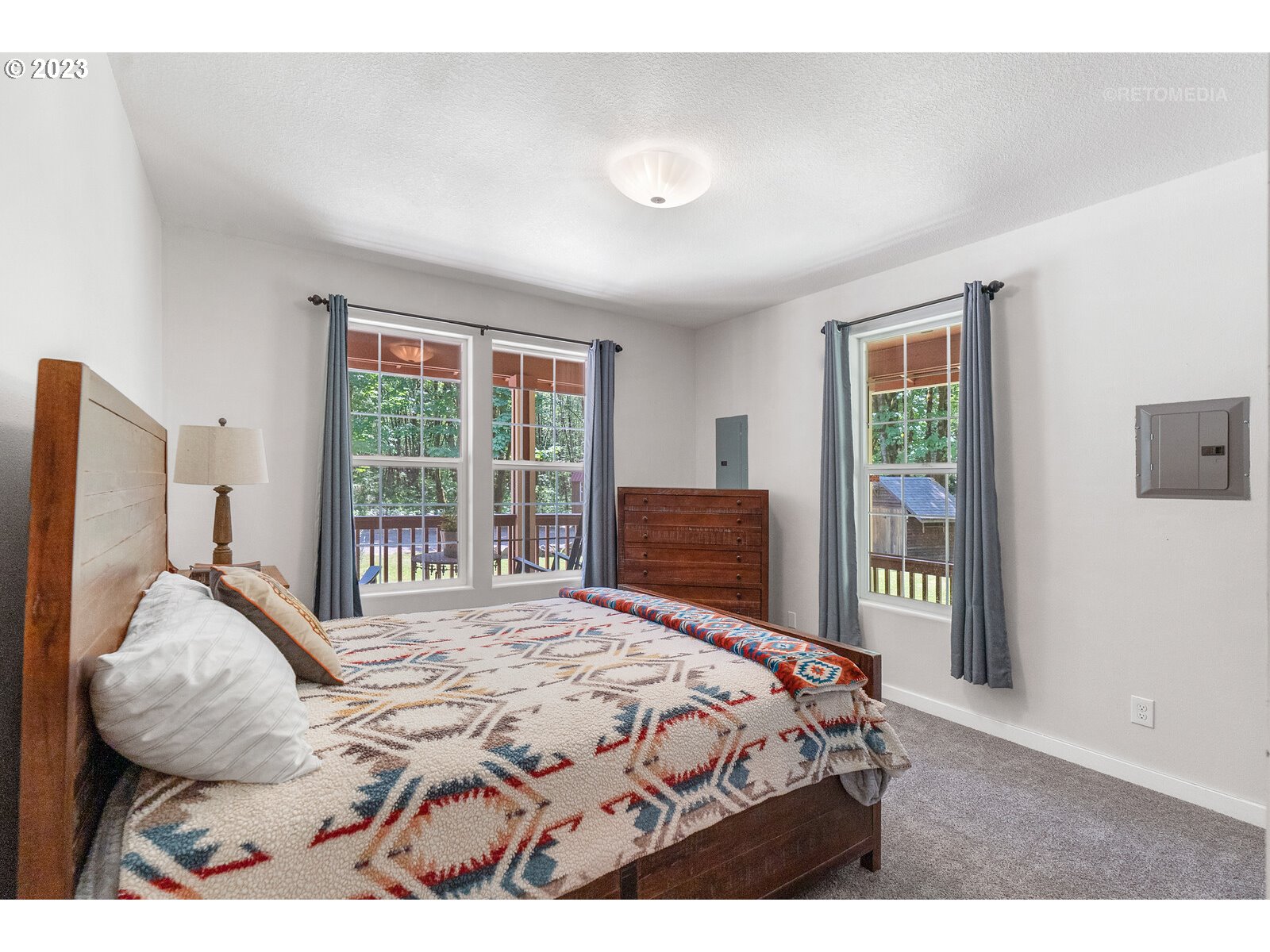 53550 Northwest Strassel Road Forest Grove, OR 97116 - Photo 13 of 44 a bedroom with a bed and a large window