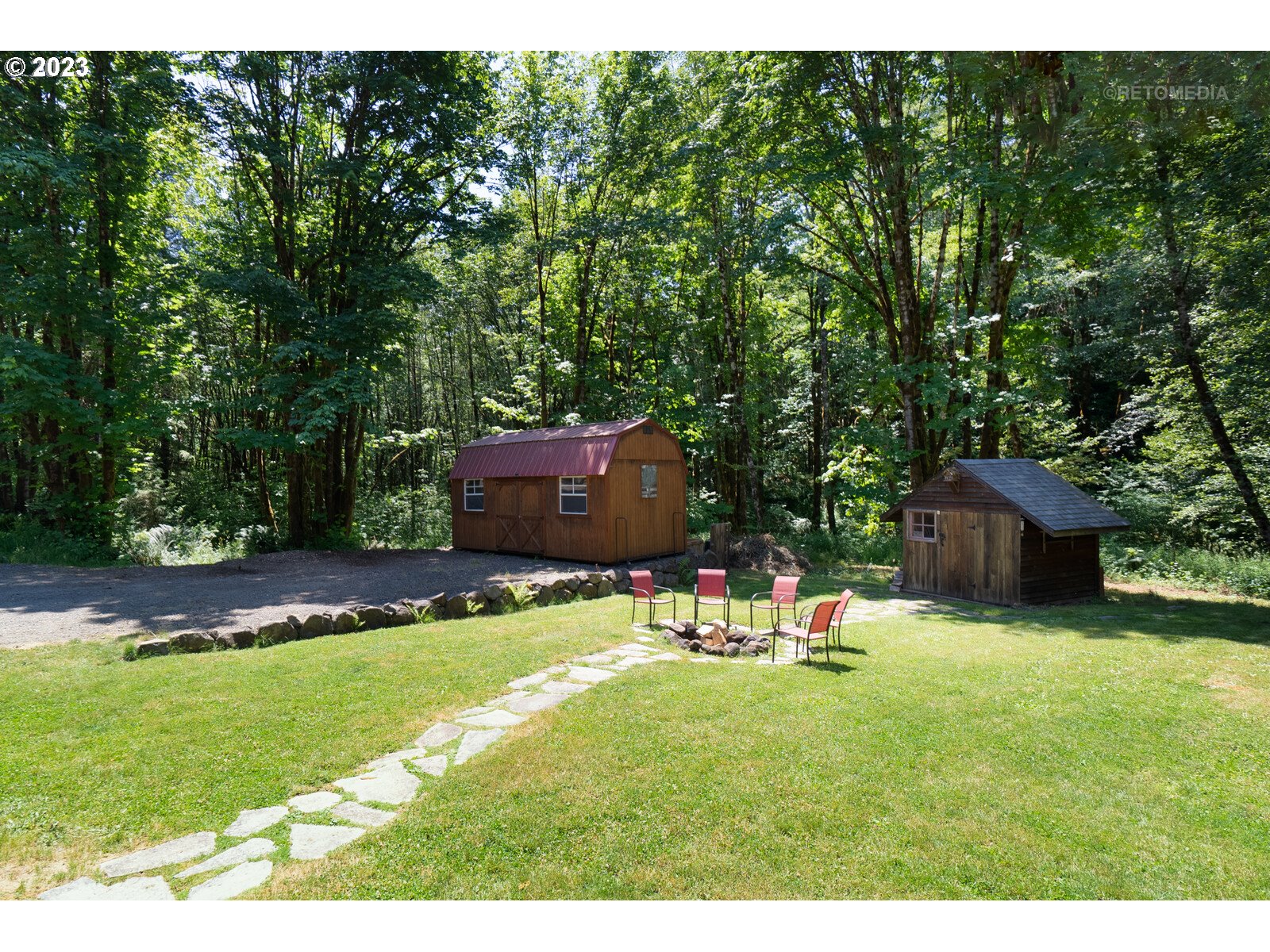 53550 Northwest Strassel Road Forest Grove, OR 97116 - Photo 24 of 44 a backyard of a house with yard and trampoline