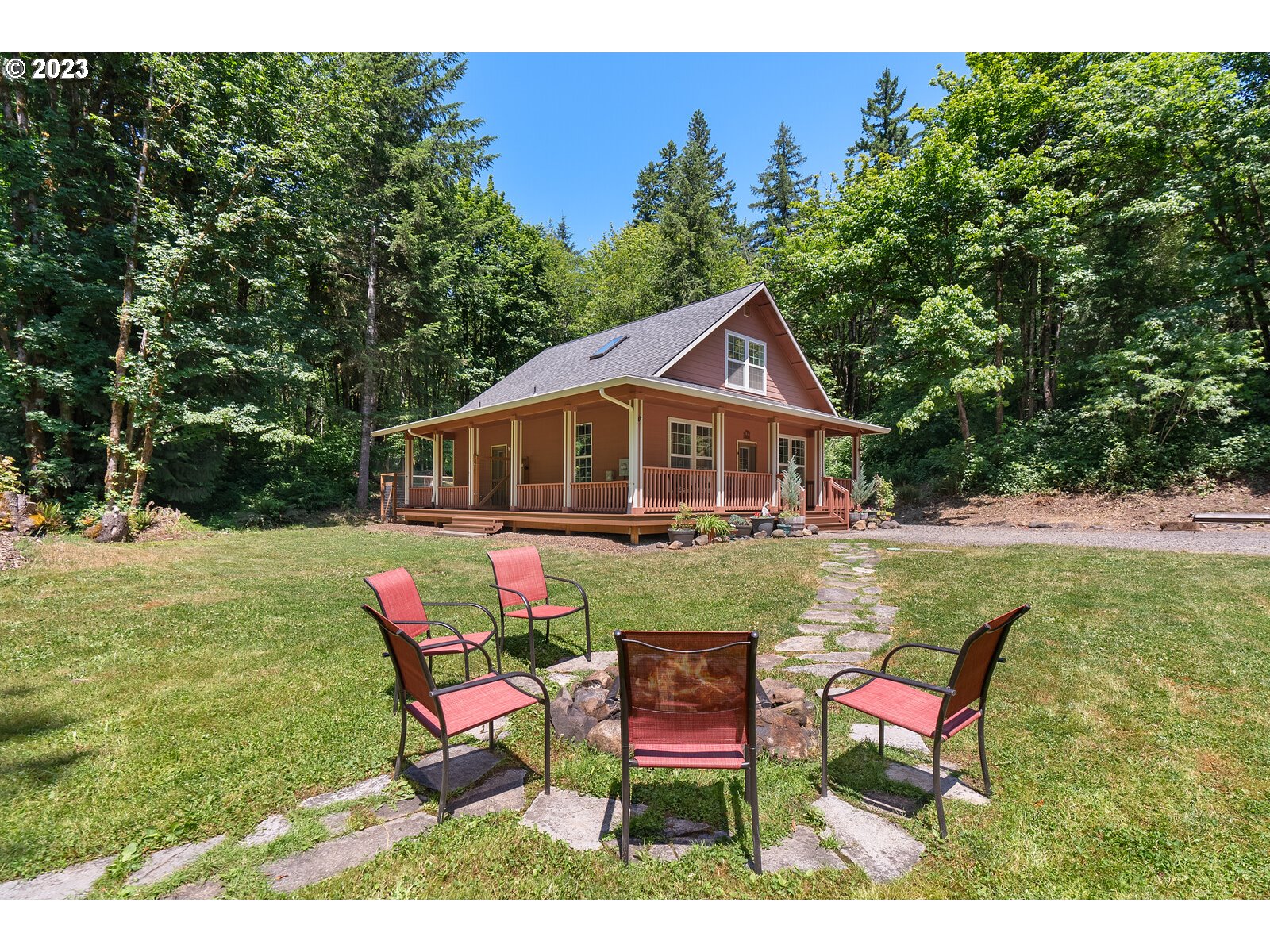 53550 Northwest Strassel Road Forest Grove, OR 97116 - Photo 25 of 44 a backyard of a house with outdoor seating