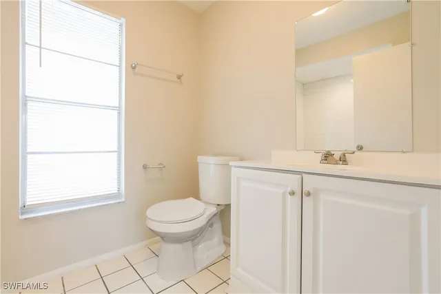 a bathroom with a sink toilet and vanity