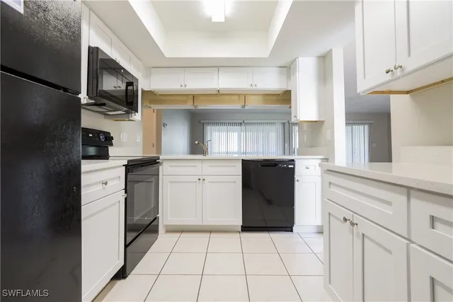 a kitchen with a refrigerator stove and sink
