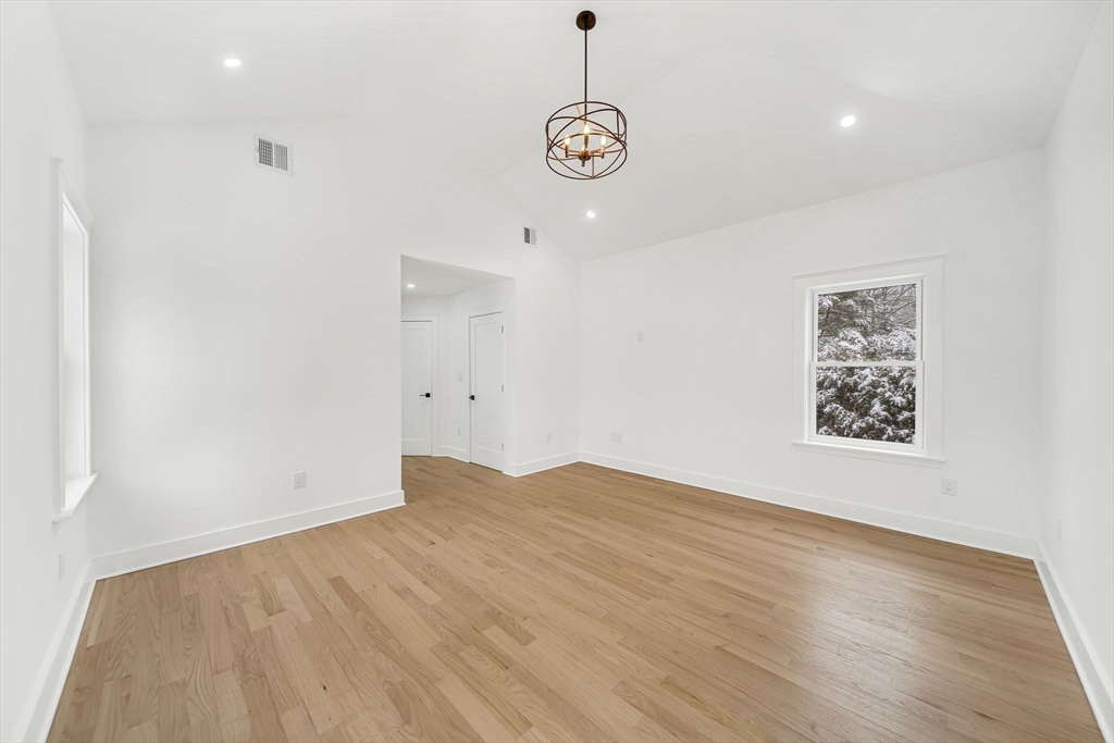 1 Sunnyside Avenue Wellesley, MA 02482 - Photo 13 of 30 a view of empty room with wooden floor