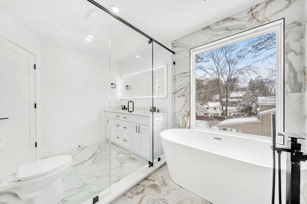 1 Sunnyside Avenue Wellesley, MA 02482 - Photo 14 of 30 a bathroom with a bathtub sink and mirror