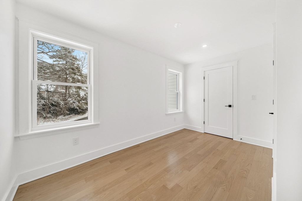 1 Sunnyside Avenue Wellesley, MA 02482 - Photo 19 of 30 a view of an empty room with a window