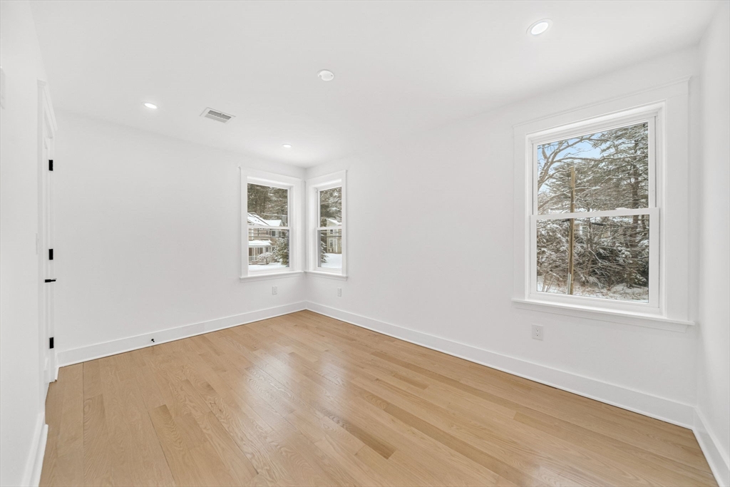 1 Sunnyside Avenue Wellesley, MA 02482 - Photo 22 of 30 wooden floor in an empty room with a window