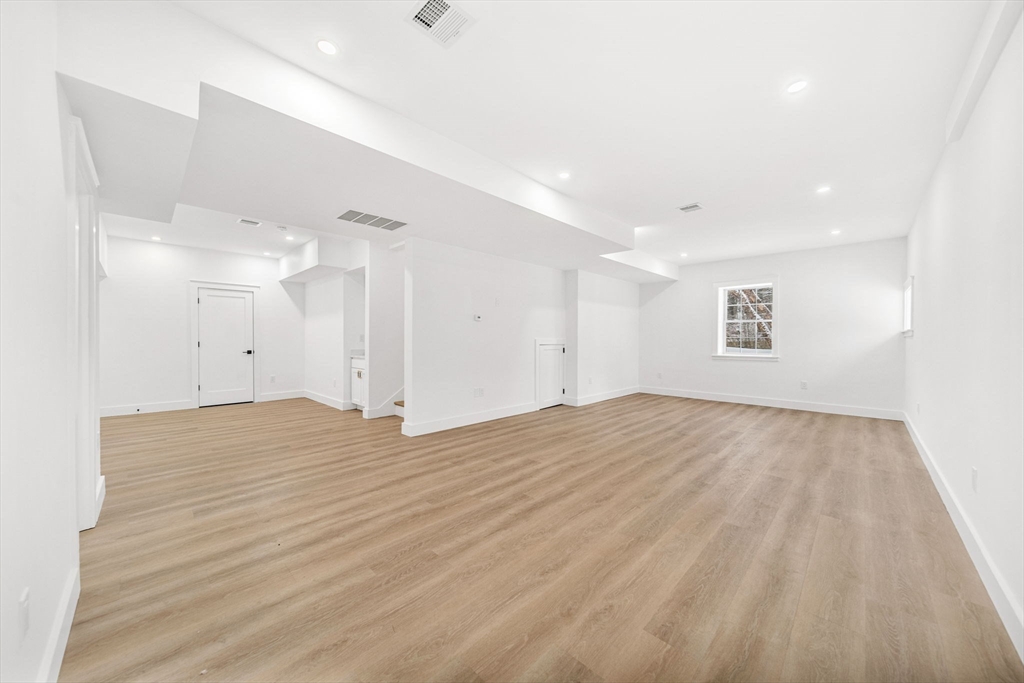 1 Sunnyside Avenue Wellesley, MA 02482 - Photo 26 of 30 a view of empty room with wooden floor