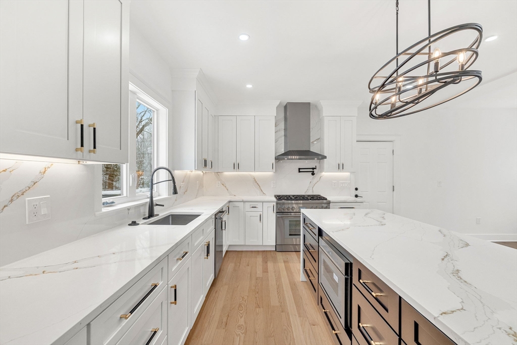 1 Sunnyside Avenue Wellesley, MA 02482 - Photo 3 of 30 a large white kitchen with a sink and dishwasher a stove with wooden floor