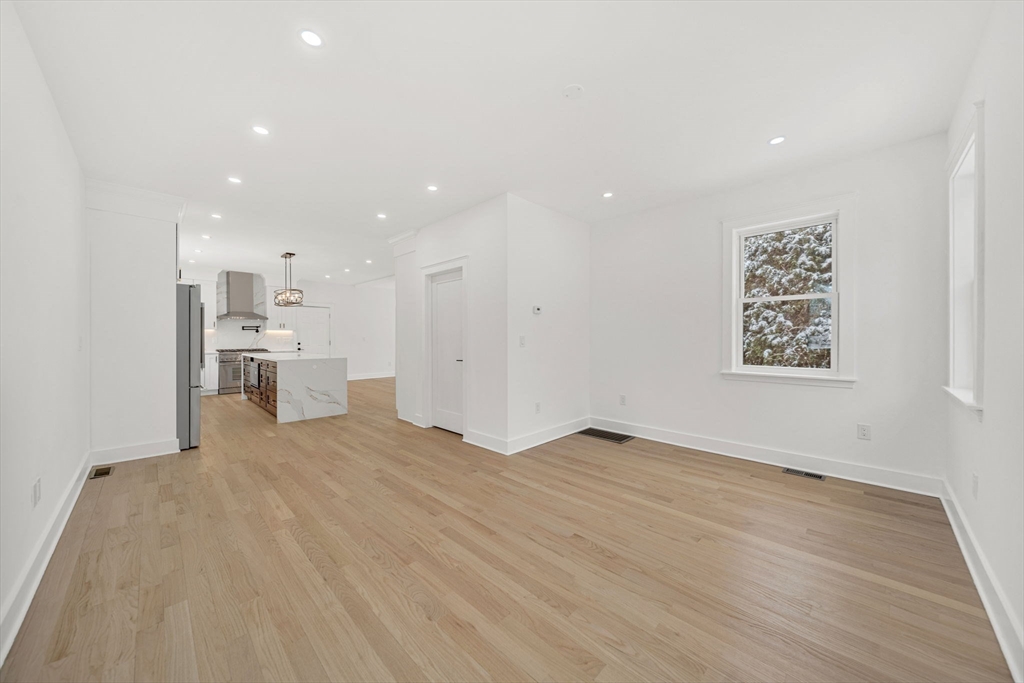 1 Sunnyside Avenue Wellesley, MA 02482 - Photo 7 of 30 a view of workspace with wooden floor and windows