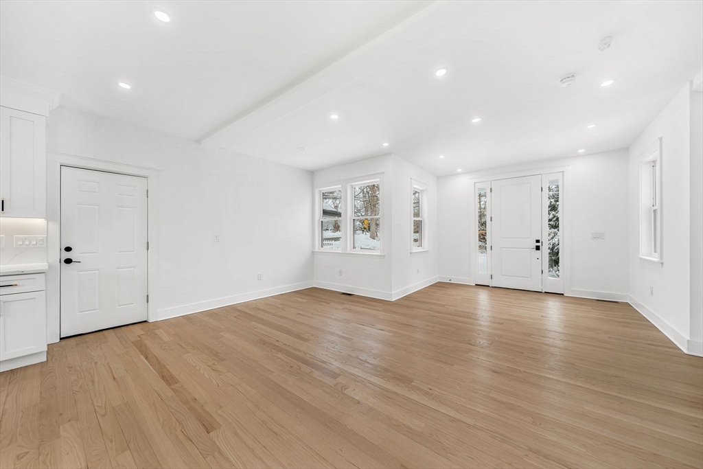 1 Sunnyside Avenue Wellesley, MA 02482 - Photo 8 of 30 wooden floor in an empty room with a window