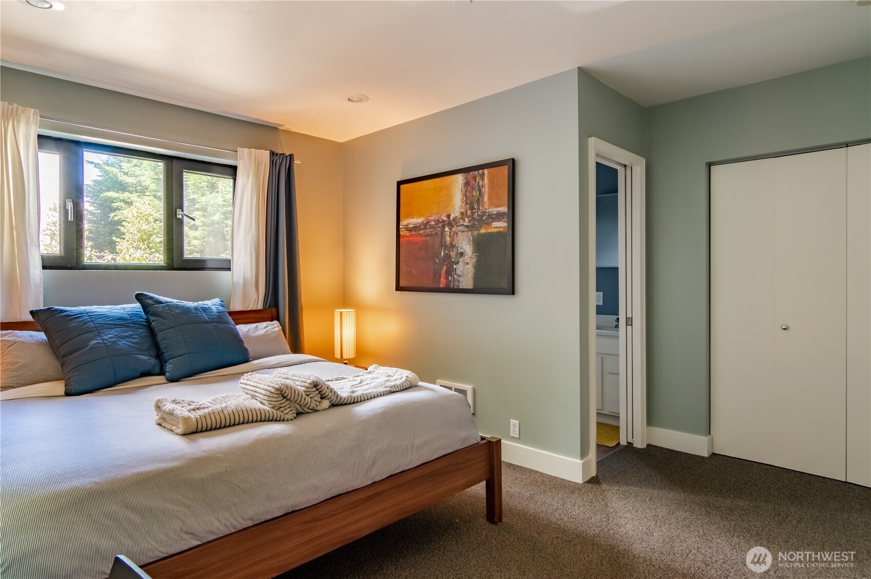 1629 13th Avenue Seattle, WA 98122 - Photo 24 of 27 a bedroom with a bed and a window