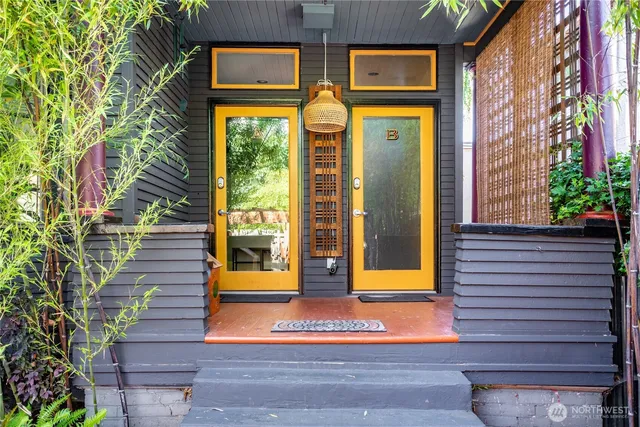 a view of a brick house with large windows
