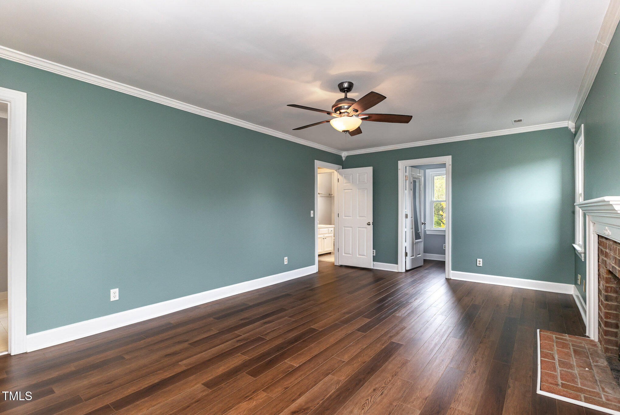 3940 Iron Horse Road Raleigh, NC 27616 - Photo 14 of 22 a view of an empty room with a window and wooden floor