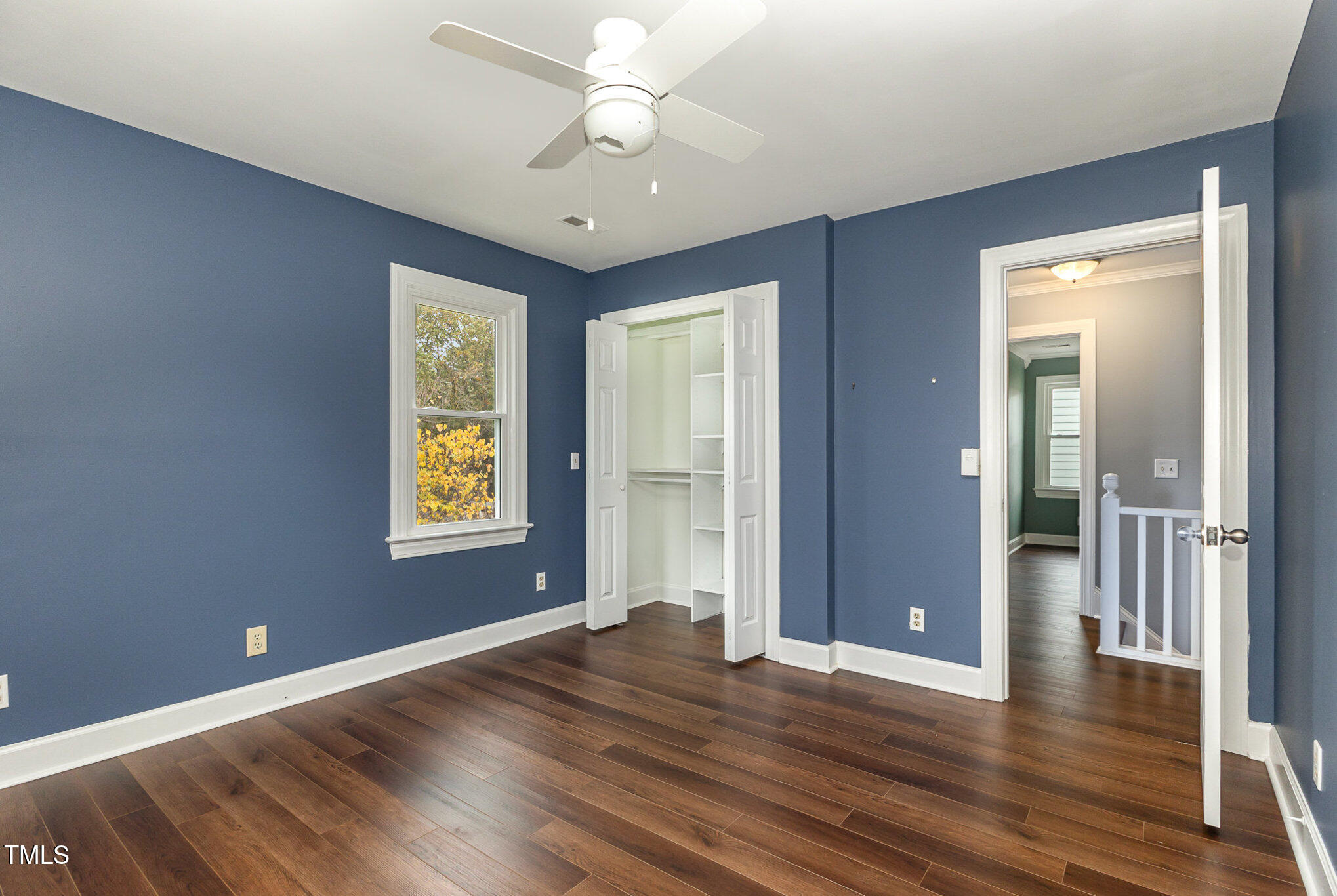 3940 Iron Horse Road Raleigh, NC 27616 - Photo 17 of 22 an empty room with wooden floor and windows