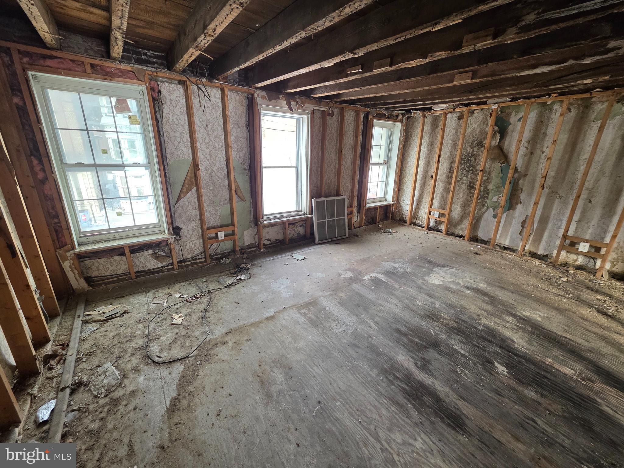 426 Centre Street Ashland, PA 17921 - Photo 19 of 30 a view of an empty room with wooden floor and a window