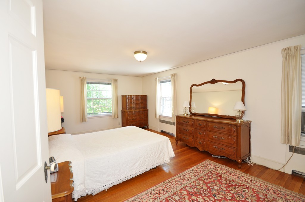 22 Bates Road Arlington, MA 02474 - Photo 18 of 30 a bedroom with a bed and window