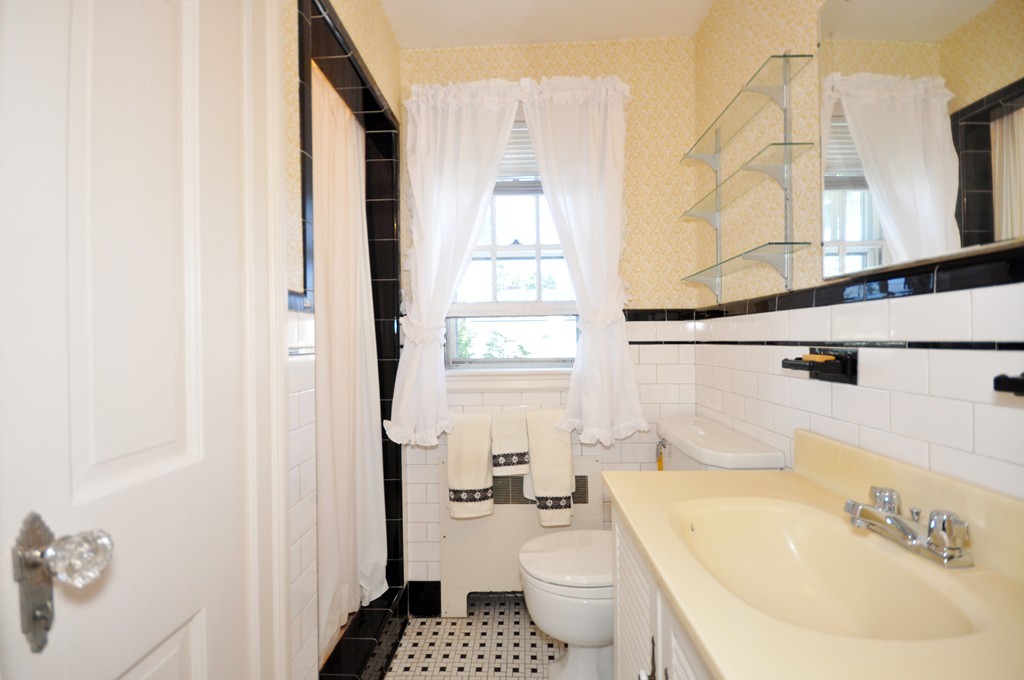 22 Bates Road Arlington, MA 02474 - Photo 19 of 30 a bathroom with a sink toilet and shower