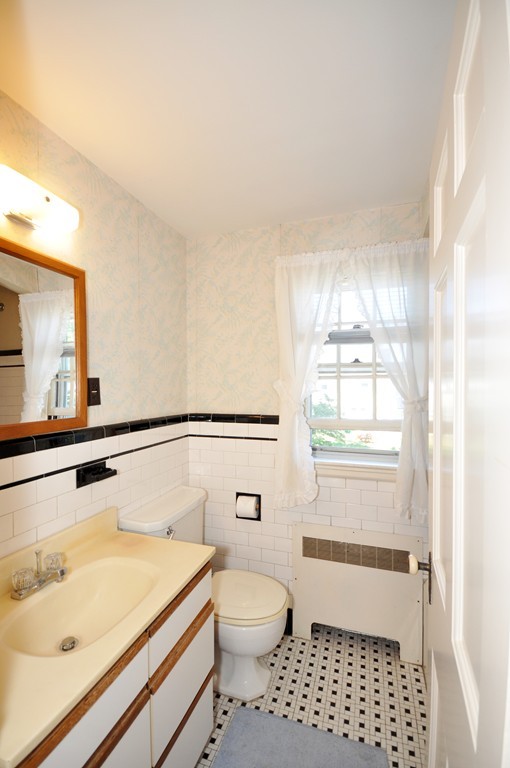 22 Bates Road Arlington, MA 02474 - Photo 21 of 30 a bathroom with a sink toilet vanity and bathtub