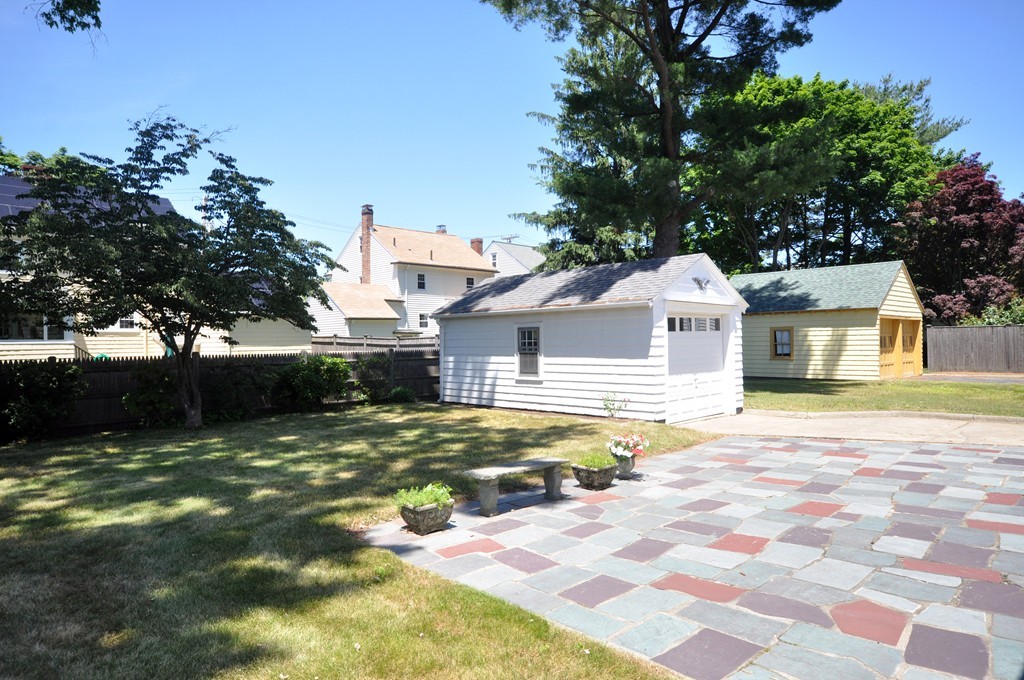 22 Bates Road Arlington, MA 02474 - Photo 27 of 30 a front view of a house with a yard