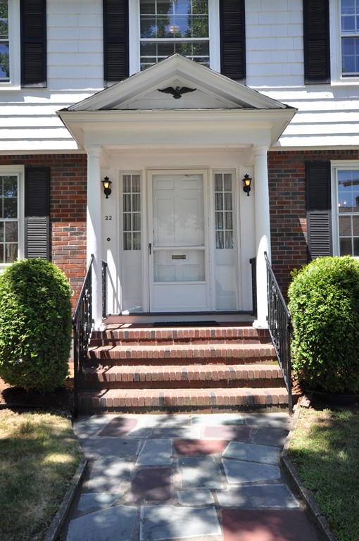 22 Bates Road Arlington, MA 02474 - Photo 3 of 30 a front view of a house with a yard