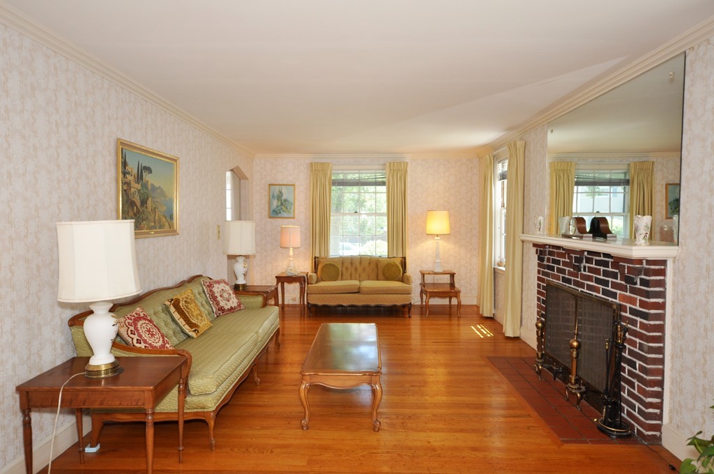 22 Bates Road Arlington, MA 02474 - Photo 8 of 30 a living room with furniture and a fireplace