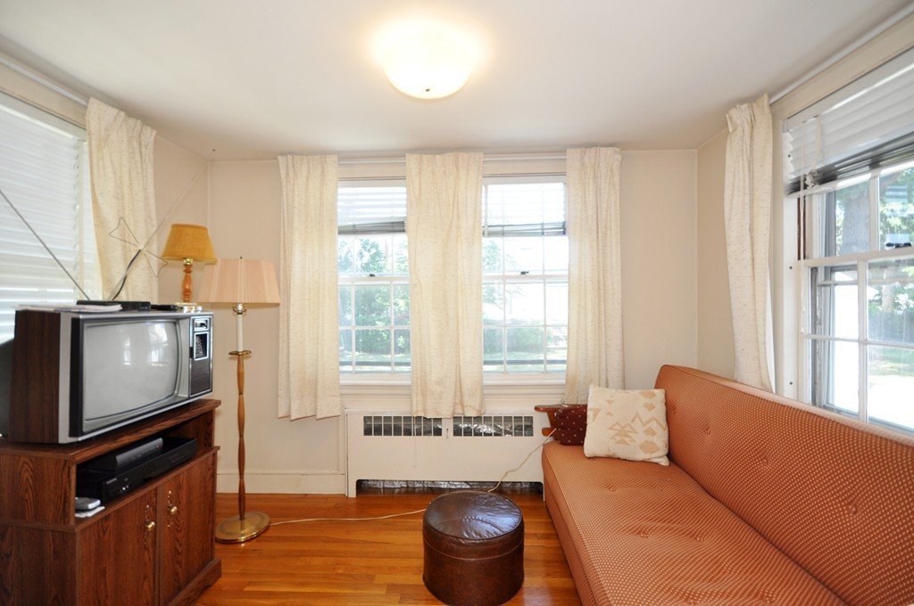 22 Bates Road Arlington, MA 02474 - Photo 10 of 30 a living room with furniture and a window