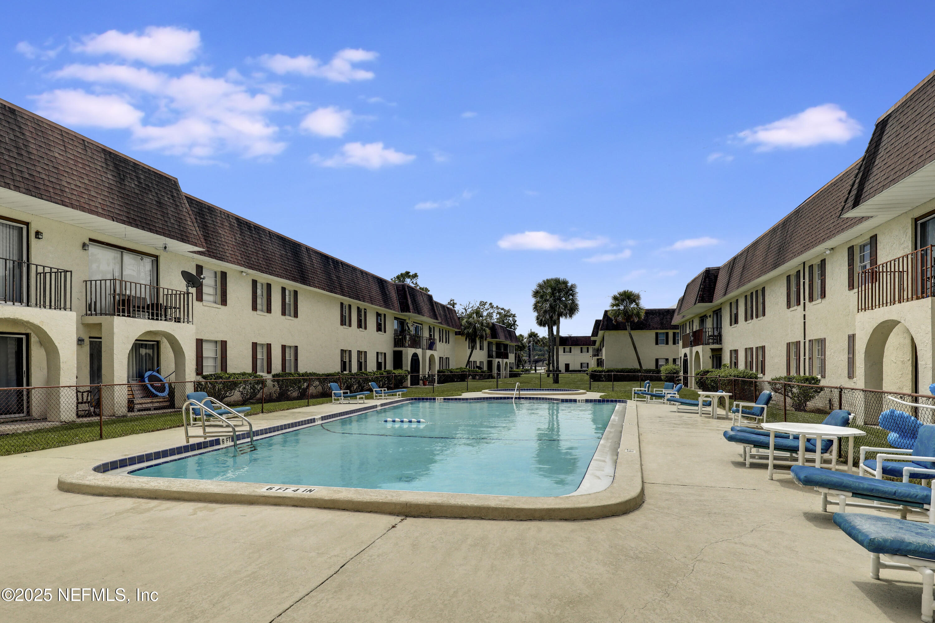 1618 El Camino Road, Unit 2 Jacksonville, FL 32216 - Photo 3 of 35 a view of a swimming pool with a bench