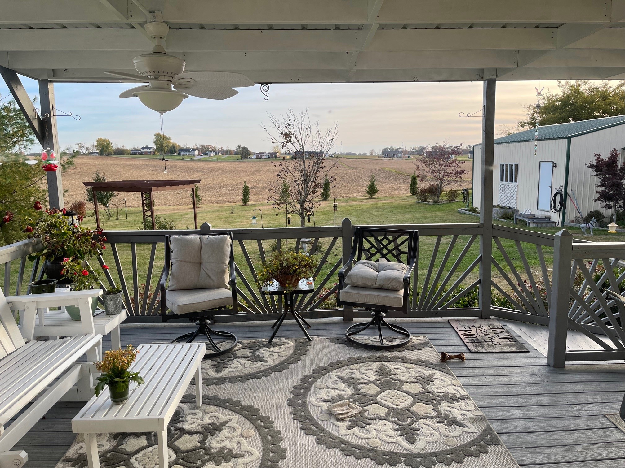488 Cook Road Portland, TN 37148 - Photo 11 of 24 a view of a balcony with chairs and wooden floor