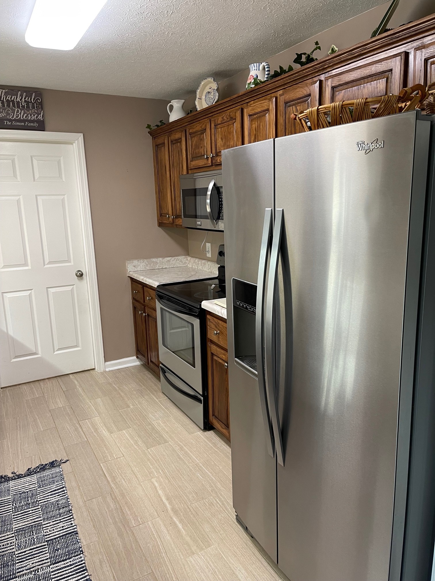 488 Cook Road Portland, TN 37148 - Photo 13 of 24 a metallic refrigerator freezer sitting in a kitchen