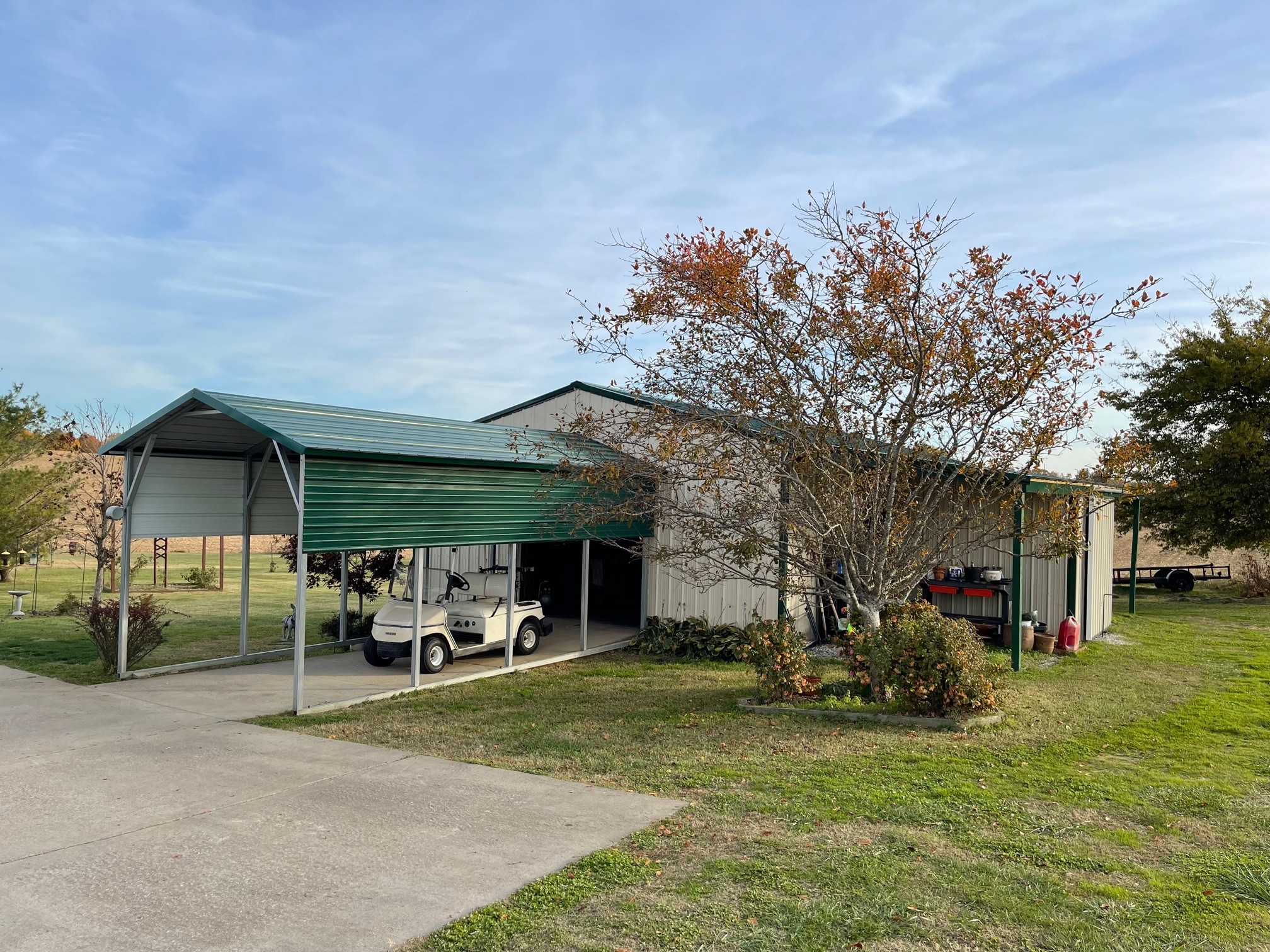 488 Cook Road Portland, TN 37148 - Photo 8 of 24 a view of a patio with table and chairs under an umbrella