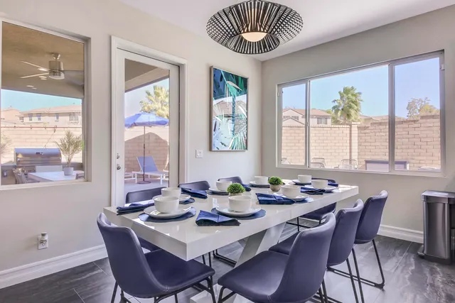 a open kitchen with cabinets a sink and a stove with wooden floor