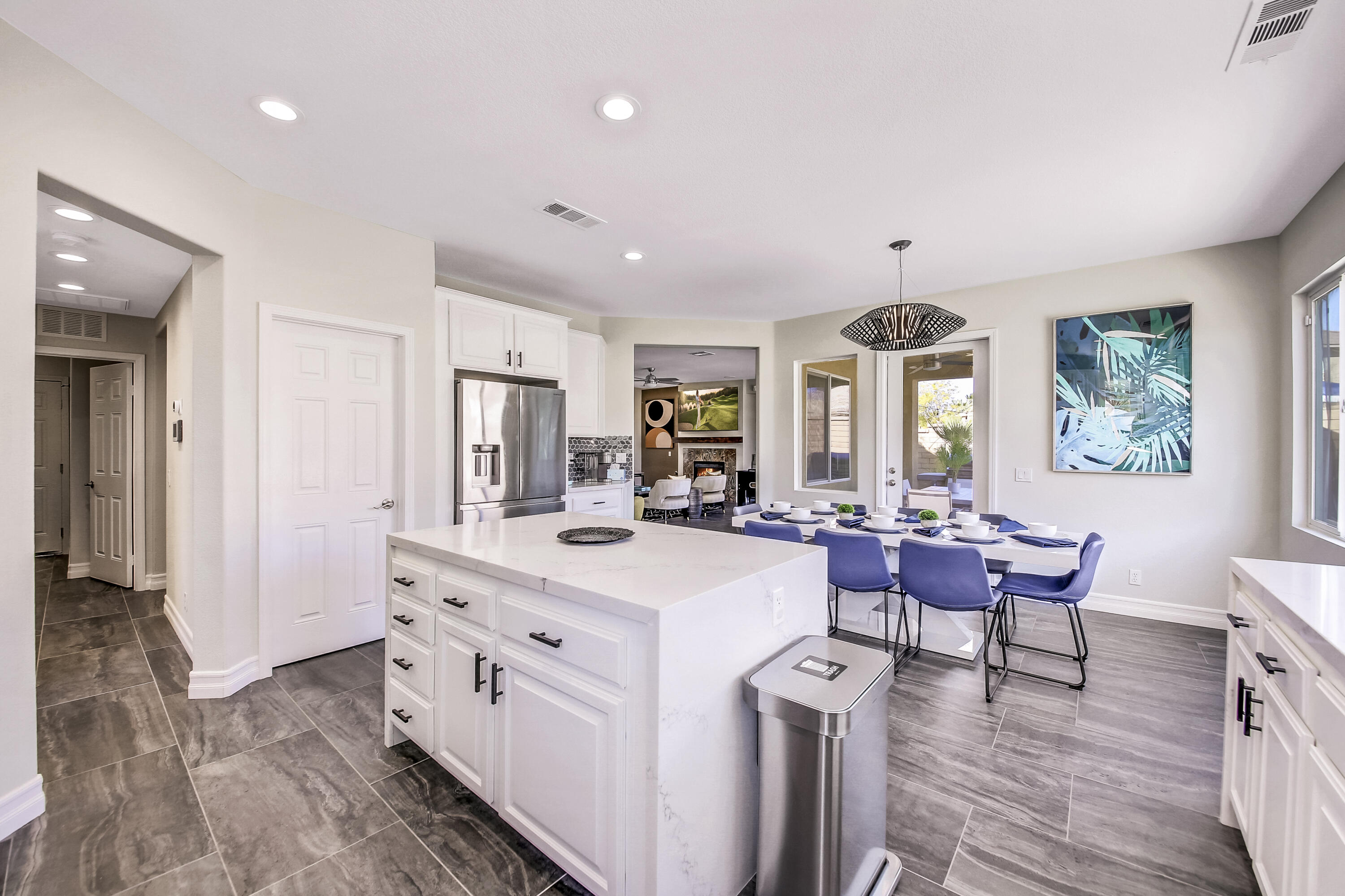 42942 Del Lago Court Indio, CA 92203 - Photo 13 of 75 a view of a dining room with furniture window and wooden floor