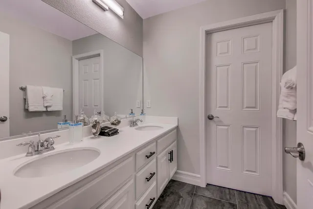 a bedroom with a bed wooden floor and window