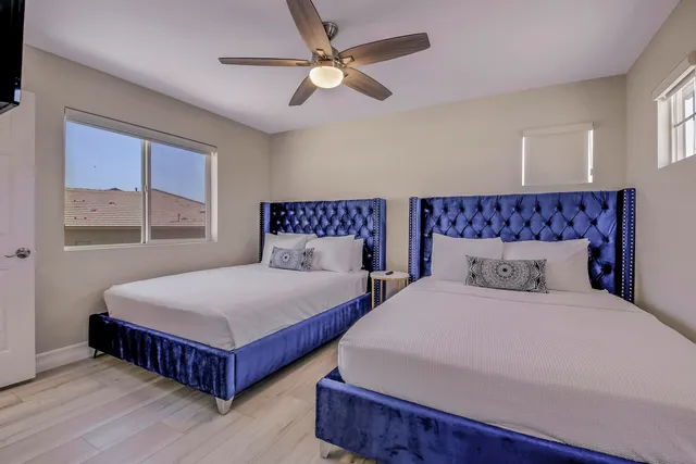 a bedroom with a bed and a chandelier