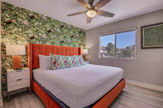 a bedroom with a bed and a couch