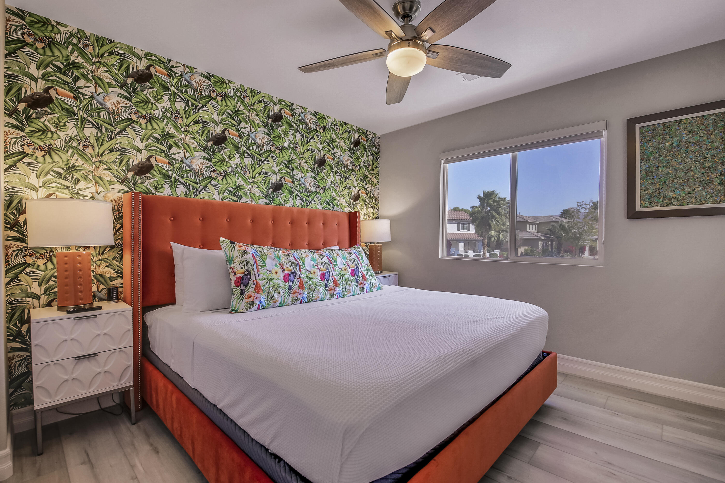 42942 Del Lago Court Indio, CA 92203 - Photo 20 of 75 a bedroom with a large bed and a chandelier