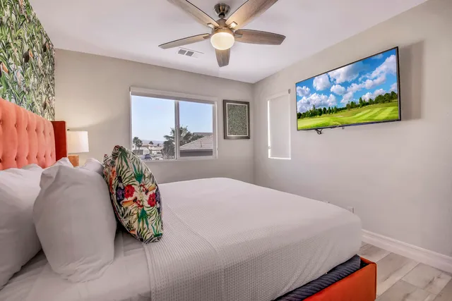 a bathroom with double vanity sinks and a mirror