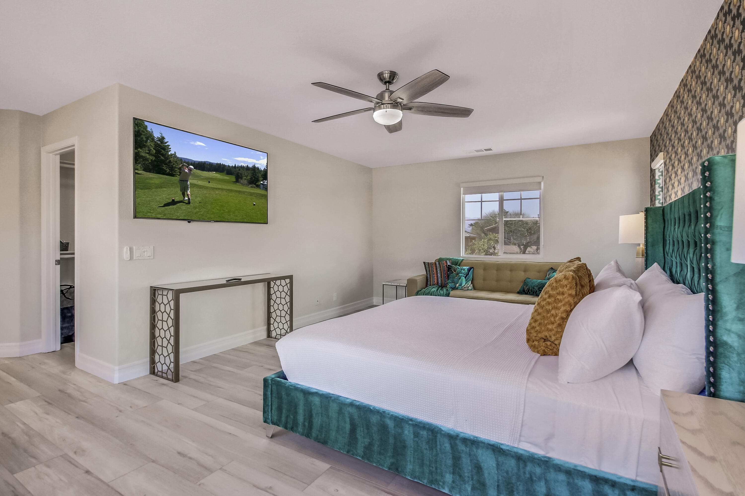 42942 Del Lago Court Indio, CA 92203 - Photo 25 of 75 a bedroom with a bed and a chandelier