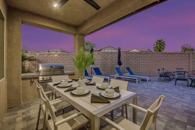 a view of a swimming pool with lounge chairs