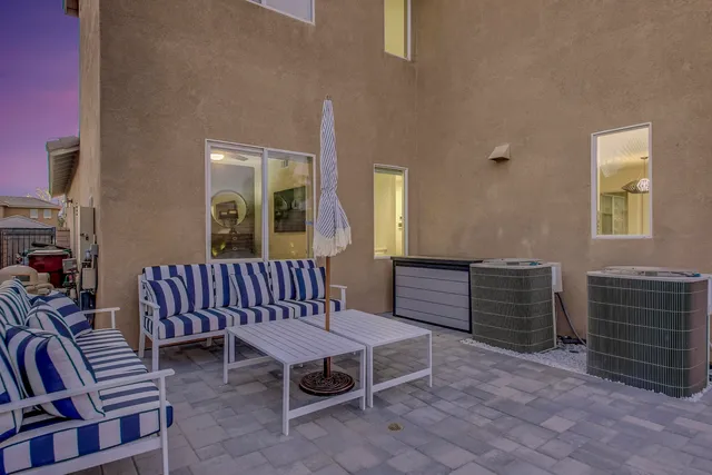 a view of a swimming pool with an outdoor space and seating area