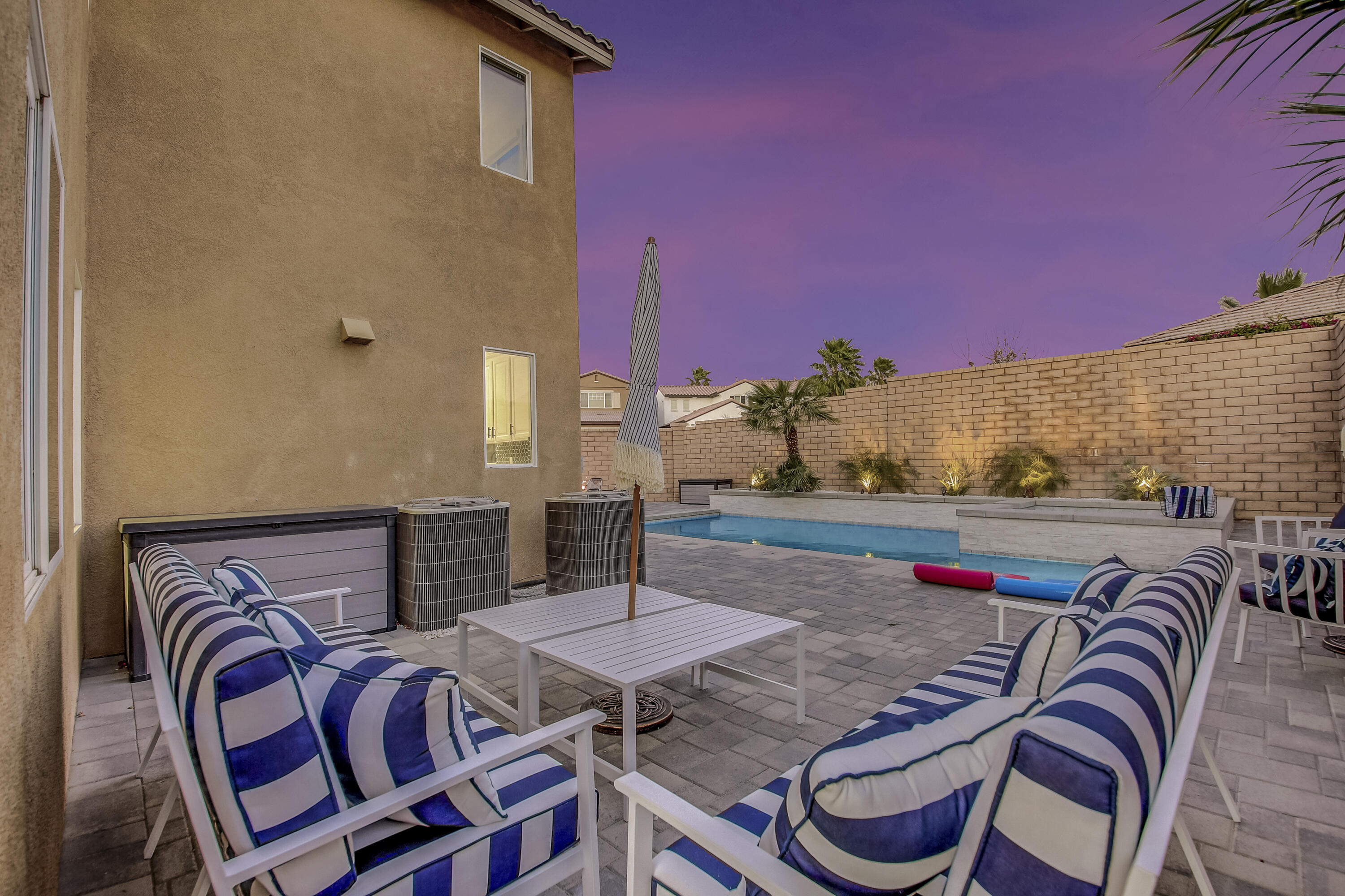 42942 Del Lago Court Indio, CA 92203 - Photo 35 of 75 a view of a patio with table and chairs with potted plants